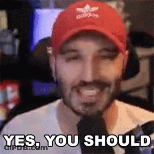A Man Wearing A Red Hat Is Smiling And Saying Yes You Should . GIF