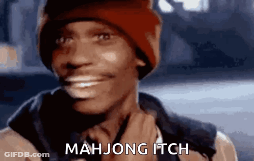 A Man Wearing A Red Hat Is Smiling And Says Mah Jong Itch . GIF