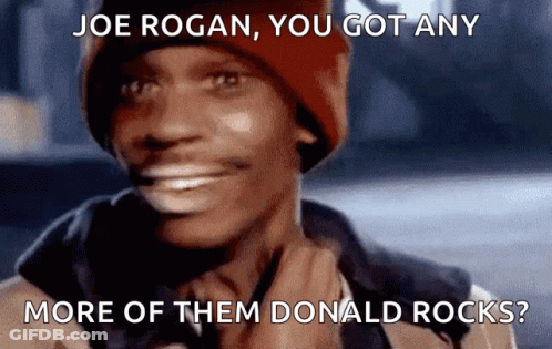 A Man Wearing A Red Hat Is Smiling With The Caption Joe Rogan You Got Any More Of Them Donald Rocks ? GIF