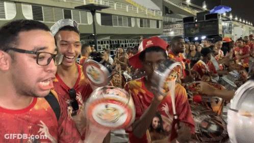 A Man Wearing A Red Hat That Says Rio De Janeiro GIF