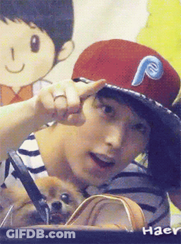 A Man Wearing A Red Hat With A Blue Letter P On It GIF