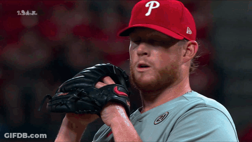 A Man Wearing A Red Hat With A Letter P On It GIF