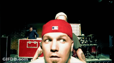 A Man Wearing A Red Hat With The Letters Mlb On It GIF