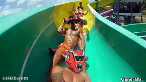 A Man Wearing A Red Helmet Is Sliding Down A Water Slide At General 'S GIF