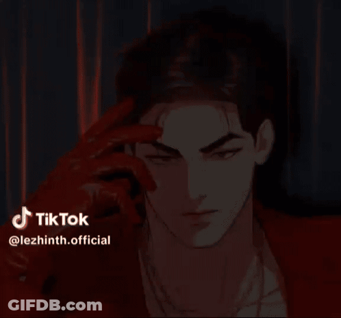 A Man Wearing A Red Jacket And Red Gloves Is Looking At The Camera . GIF