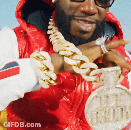 Man In Red Jacket Holding Pendant Saying 11 GIF