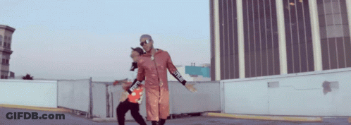 A Man Wearing A Red Jacket With The Word Supreme On The Sleeves GIF
