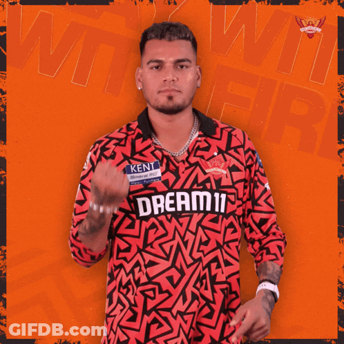 A Man Wearing A Red Jersey That Says Dream11 GIF