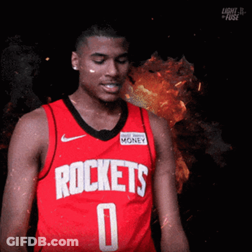 A Man Wearing A Red Jersey That Says Rockets On It GIF