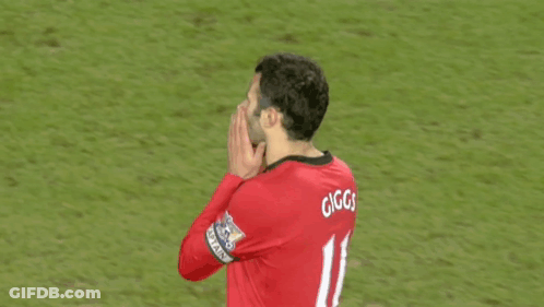A Man Wearing A Red Jersey With Gg On The Back GIF