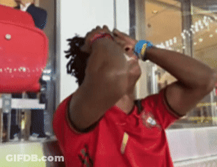 A Man Wearing A Red Jersey With The Number 1 On The Front GIF