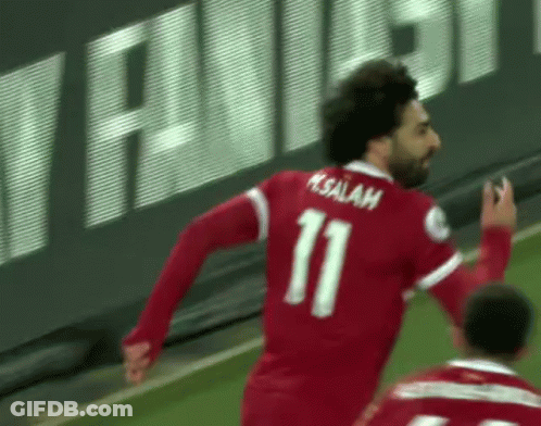 A Man Wearing A Red Jersey With The Number 11 On It GIF