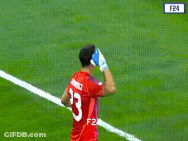 A Man Wearing A Red Jersey With The Number 23 On It GIF