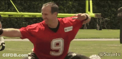 A Man Wearing A Red Jersey With The Number 9 On It Is On A Football Field GIF