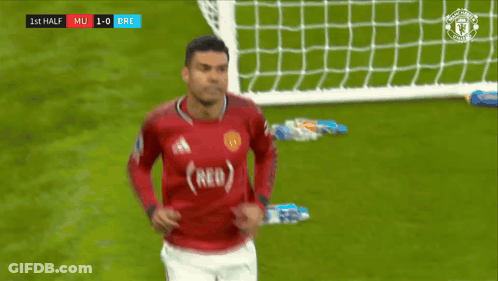 A Man Wearing A Red Jersey With The Word Red On The Front GIF