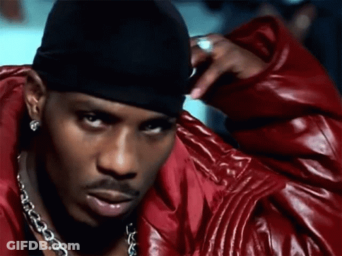 A Man Wearing A Red Leather Jacket And A Black Headband GIF