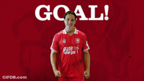 A Man Wearing A Red Pure Energie Shirt Stands In Front Of A Red Background GIF