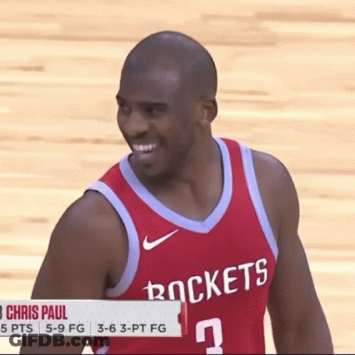 A Man Wearing A Red Rockets Jersey Smiles GIF