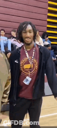 Man In Red Shirt And Black Jacket On Basketball Court GIF