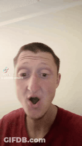 A Man Wearing A Red Shirt Is Making A Funny Face With Tiktok Written On The Bottom Right GIF
