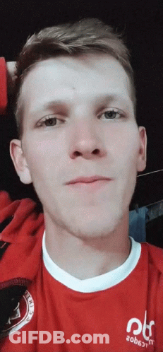 A Man Wearing A Red Shirt That Says 20B6jtn On It GIF