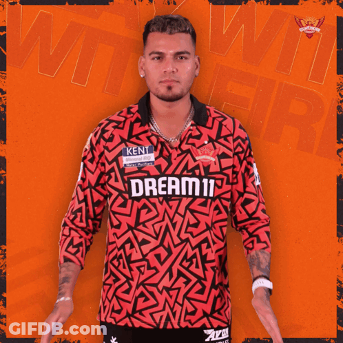 A Man Wearing A Red Shirt That Says Dream11 GIF