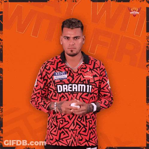 A Man Wearing A Red Shirt That Says Dream11 On It GIF