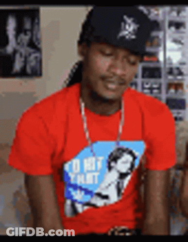 A Man Wearing A Red Shirt That Says I 'D Hit That On It GIF