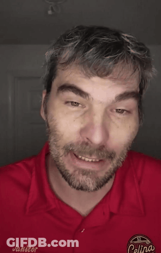 A Man Wearing A Red Shirt That Says " I Didn 'T Care " GIF