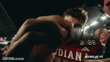 A Man Wearing A Red Shirt That Says Indiana GIF