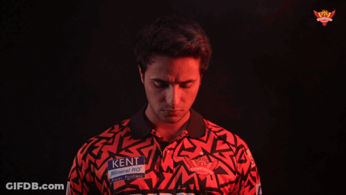 A Man Wearing A Red Shirt That Says Kent Mineral Ro GIF