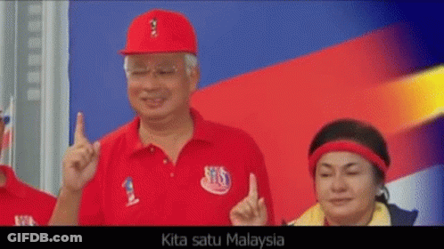 A Man Wearing A Red Shirt That Says Kita Satu Malaysia Is Giving A Thumbs Up GIF