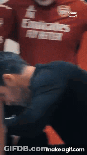 A Man Wearing A Red Shirt That Says ' Prime ' On It GIF