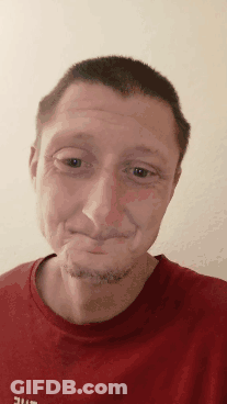 A Man Wearing A Red Shirt That Says Ufc On It Makes A Funny Face GIF