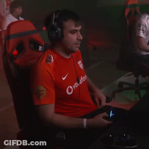 A Man Wearing A Red Shirt That Says Vodafone GIF