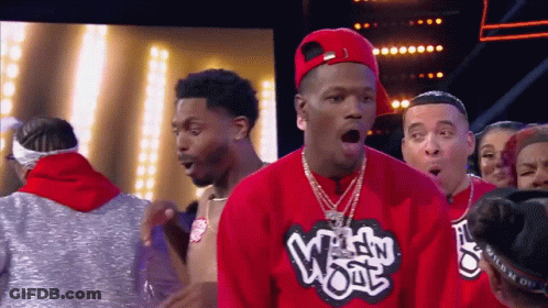 A Man Wearing A Red Shirt That Says Wild Wool GIF