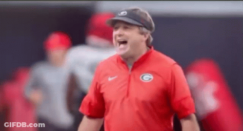 A Man Wearing A Red Shirt With The Letter G On It GIF