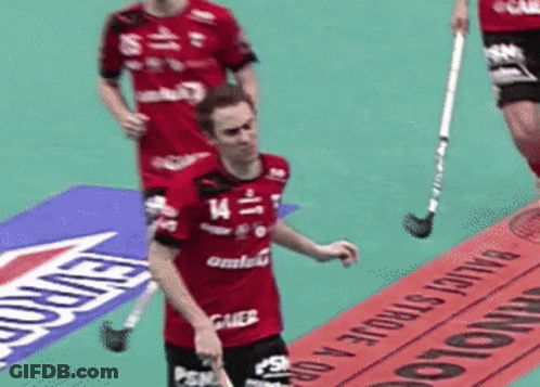 A Man Wearing A Red Shirt With The Number 14 On It GIF