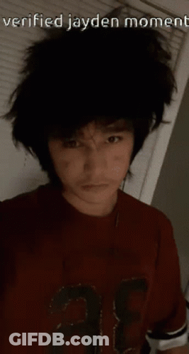 A Man Wearing A Red Shirt With The Number 3 On It GIF