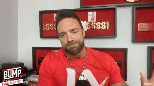 A Man Wearing A Red Shirt With The Word Bump On The Bottom GIF