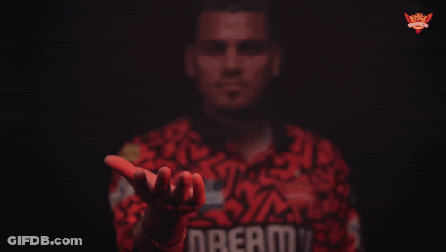 A Man Wearing A Red Shirt With The Word Dream On It GIF