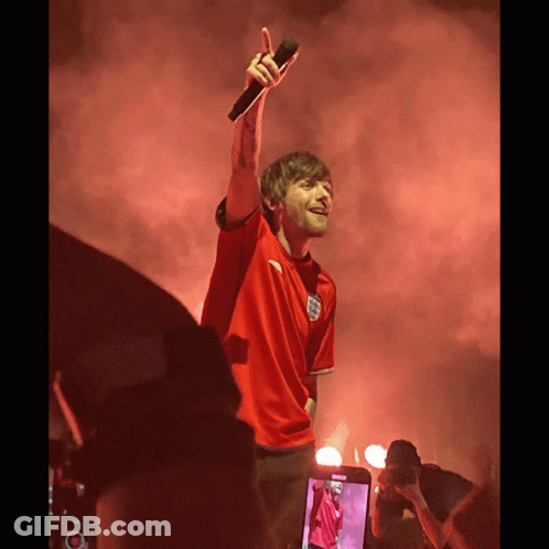 A Man Wearing A Red Shirt With The Word England On It GIF