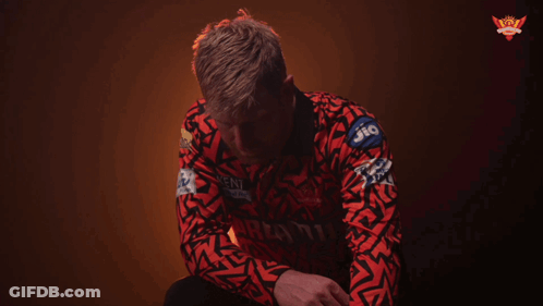 A Man Wearing A Red Shirt With The Word Knock On The Bottom GIF