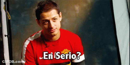 A Man Wearing A Red Shirt With The Words En Serio On It GIF