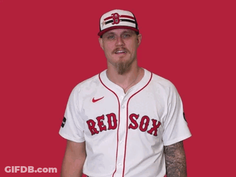 A Man Wearing A Red Sox Jersey Is Smiling GIF
