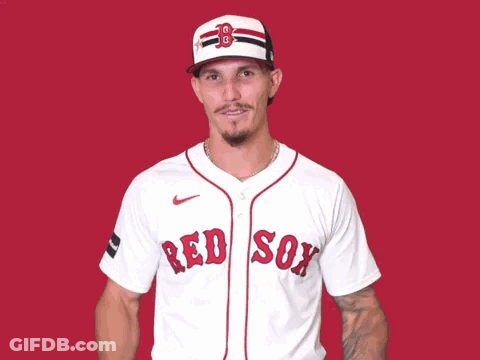 A Man Wearing A Red Sox Jersey With His Hands Up GIF