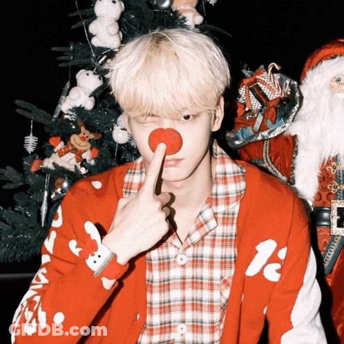 A Man Wearing A Red Sweater With A Reindeer On It GIF