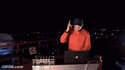 A Man Wearing A Red Sweatshirt That Says Nyc On It GIF