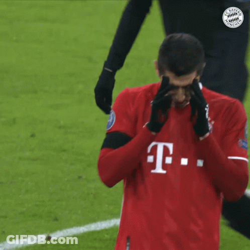 A Man Wearing A Red T-Mobile Jersey Covering His Nose GIF