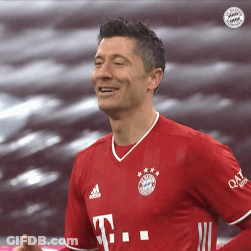 A Man Wearing A Red T-Mobile Jersey Smiles For The Camera GIF